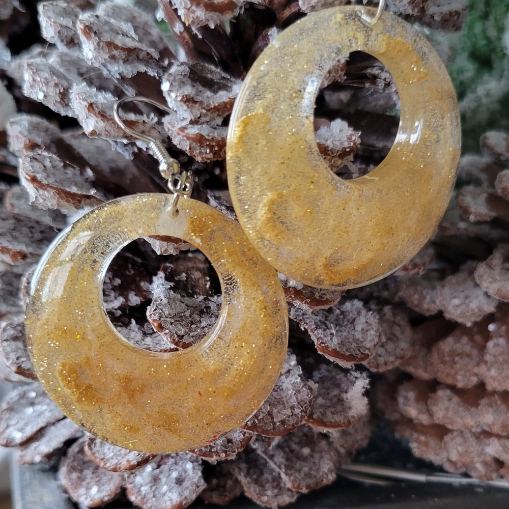Resin earrings.  Gold in color, silver hardware